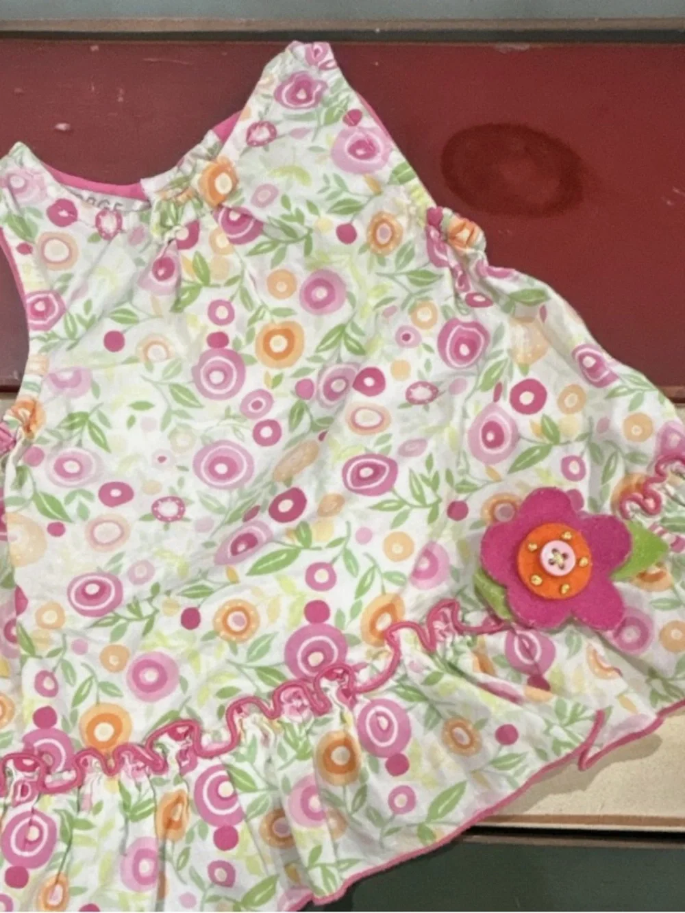 George Floral Bib in Pink, Orange, Green and White with Felt Flower